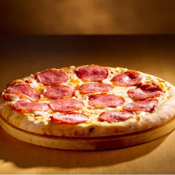 A whole pepperoni pizza from Paramount Pizza 3, with melted cheese and a golden crust.