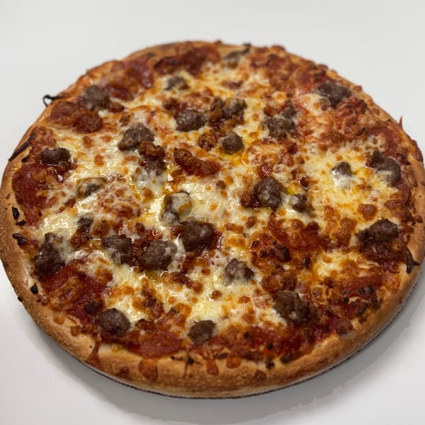 A Paramount Pizza 3 meat lover's pizza, topped with pepperoni, sausage, and melted cheese.